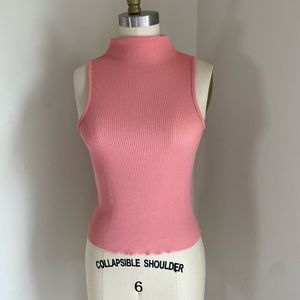 Pink sleeveless turtleneck top. Size 4